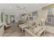Relaxing living room with comfortable seating and a view of the backyard at 4259 Whispering Oaks Dr, North Port, FL 34287