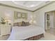 Main bedroom with king-size bed, ensuite bathroom, and plenty of natural light at 4259 Whispering Oaks Dr, North Port, FL 34287