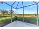 Spacious screened-in porch with view of the golf course at 4259 Whispering Oaks Dr, North Port, FL 34287