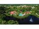 Community pool and clubhouse with lake views at 430 Marsh Creek Rd, Venice, FL 34292