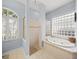 Relaxing bathroom with a soaking tub and separate shower at 430 Marsh Creek Rd, Venice, FL 34292