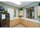Well-equipped community kitchen with ample cabinetry and appliances at 430 Marsh Creek Rd, Venice, FL 34292
