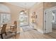 Bright and spacious foyer with wood-look flooring and access to other rooms at 430 Marsh Creek Rd, Venice, FL 34292