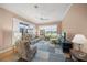 Bright Gathering room with water view, comfortable furniture, and tiled floors at 430 Marsh Creek Rd, Venice, FL 34292