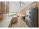 Spacious kitchen with stainless steel appliances and light wood cabinets at 430 Marsh Creek Rd, Venice, FL 34292