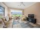 Living area with water views, comfortable seating, and a TV at 430 Marsh Creek Rd, Venice, FL 34292