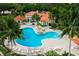 Relaxing freeform community pool with lounge chairs at 430 Marsh Creek Rd, Venice, FL 34292