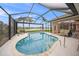Enjoy this gorgeous pool and spa with screened enclosure at 430 Marsh Creek Rd, Venice, FL 34292