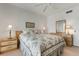 Bedroom with floral bedding and wood furniture at 458 Cerromar Rd # 483, Venice, FL 34293
