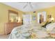 Bright bedroom with king bed, dresser, and en-suite bathroom access at 458 Cerromar Rd # 483, Venice, FL 34293