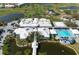 Community clubhouse with pool and landscaping at 458 Cerromar Rd # 483, Venice, FL 34293