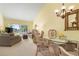 Bright living room with vaulted ceiling, comfy seating, and view at 458 Cerromar Rd # 483, Venice, FL 34293