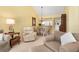 Living room with seating area and view of dining area at 458 Cerromar Rd # 483, Venice, FL 34293
