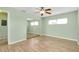 Bedroom featuring wood floors and mirrored closet at 460 Base E Ave # 122, Venice, FL 34285