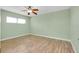 Spacious bedroom with ceiling fan and wood floors at 460 Base E Ave # 122, Venice, FL 34285