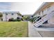 Two-story condo building with a courtyard and walkway at 460 Base E Ave # 122, Venice, FL 34285