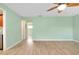 Spacious living room with light walls and laminate flooring at 460 Base E Ave # 122, Venice, FL 34285