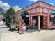 Eyeglass store storefront with unique mermaid statue at 460 Base E Ave # 122, Venice, FL 34285