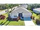 Single-story house with gray roof, screened porch, and landscaped yard at 4940 Thames Ln, Sarasota, FL 34238