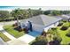 Single-story house with gray roof and lush landscaping at 4940 Thames Ln, Sarasota, FL 34238