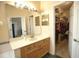 Bathroom with vanity, walk-in closet, and mirror at 4940 Thames Ln, Sarasota, FL 34238
