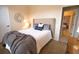 Bedroom with a queen-size bed and large window at 4940 Thames Ln, Sarasota, FL 34238