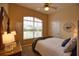 Bedroom with a queen-size bed and large window at 4940 Thames Ln, Sarasota, FL 34238
