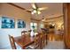 Bright dining room with hardwood floors and a view into the living room at 4940 Thames Ln, Sarasota, FL 34238