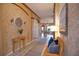 Entryway with a bench, mirror, and textured walls at 4940 Thames Ln, Sarasota, FL 34238