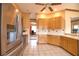 Modern kitchen with stainless steel appliances and wood cabinetry at 4940 Thames Ln, Sarasota, FL 34238