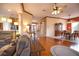 Open concept living room with hardwood floors and views to kitchen and dining areas at 4940 Thames Ln, Sarasota, FL 34238