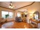 Spacious living room featuring hardwood floors and ample natural light at 4940 Thames Ln, Sarasota, FL 34238