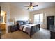 Main bedroom with large window and dark wood furniture at 4940 Thames Ln, Sarasota, FL 34238