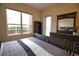 Main bedroom with backyard access and large window at 4940 Thames Ln, Sarasota, FL 34238