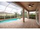 Enclosed pool and spa area with brick pavers at 4940 Thames Ln, Sarasota, FL 34238