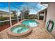 Relaxing pool and spa with screened enclosure at 4940 Thames Ln, Sarasota, FL 34238
