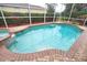 Inviting pool and spa with brick coping at 4940 Thames Ln, Sarasota, FL 34238