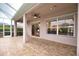 Covered patio with access to the pool area at 4940 Thames Ln, Sarasota, FL 34238