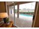 View of the refreshing pool area from the living room at 4940 Thames Ln, Sarasota, FL 34238