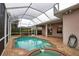 This home features a screened pool and spa at 4940 Thames Ln, Sarasota, FL 34238