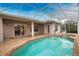 Inviting pool and spa with covered patio at 4940 Thames Ln, Sarasota, FL 34238