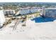 Aerial view of beachfront condo building with pool and parking at 500 The Esplanade N # 306, Venice, FL 34285