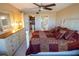 Main bedroom with king bed, dresser, and access to bathroom at 500 The Esplanade N # 306, Venice, FL 34285
