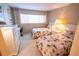 Bedroom with two twin beds, dresser, and plenty of natural light at 500 The Esplanade N # 306, Venice, FL 34285