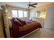 King-size bed, dresser, and ocean view from bedroom window at 500 The Esplanade N # 306, Venice, FL 34285
