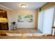 Dining area with tropical mural and tiled floor at 500 The Esplanade N # 306, Venice, FL 34285