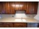 Kitchen features wood cabinets, double sink, and stainless steel dishwasher at 500 The Esplanade N # 306, Venice, FL 34285