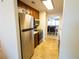 Modern kitchen with stainless steel appliances and wood cabinets at 500 The Esplanade N # 306, Venice, FL 34285