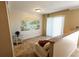 Living room features tiled floors and a tropical mural at 500 The Esplanade N # 306, Venice, FL 34285