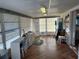 Sunroom featuring a desk, storage, and bright natural light at 518 Cervina N Dr, Venice, FL 34285